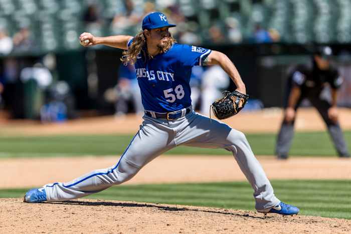 Jun 18, 2022; Oakland, California, USA; Kansas City Royals closing pitcher Scott Barlow (58) throws against the Oakland Athletics during the ninth inning at RingCentral Coliseum. Mandatory Credit: John Hefti-USA TODAY Sports